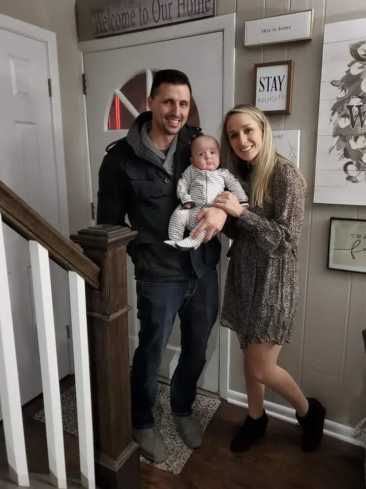 Andy Lopac with his wife Samantha and their son Henry